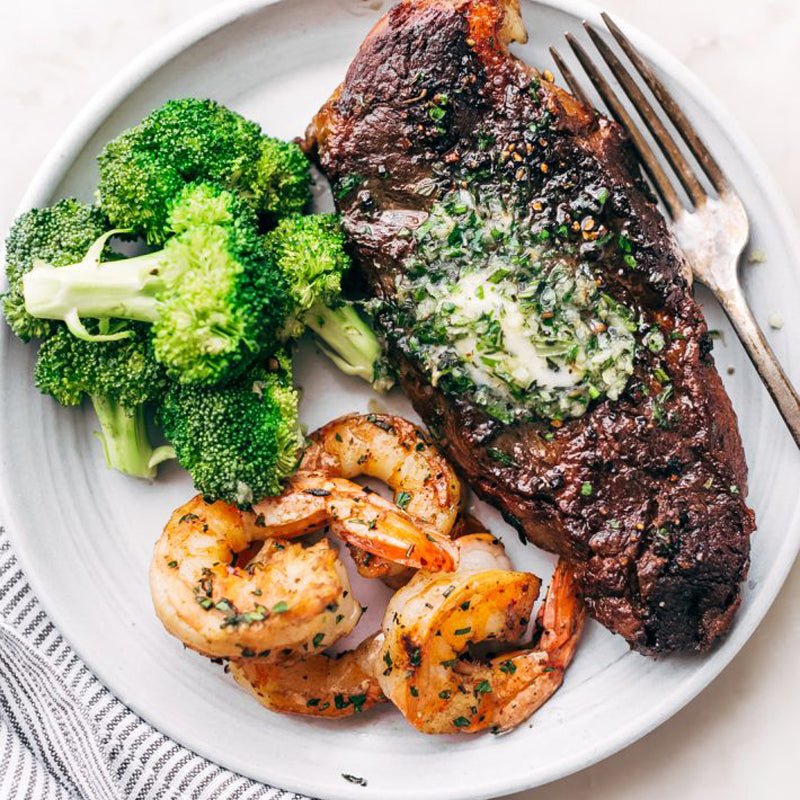 https://brydensantigua.com/cdn/shop/articles/garlic-butter-steak-and-shrimp-833276_800x.jpg?v=1644953035